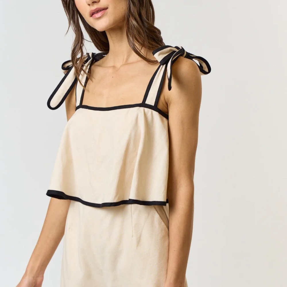 Chic Beige Sleeveless Top with Black Trim